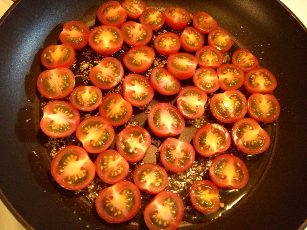 Add the tomatoes to the pan with the garlic.