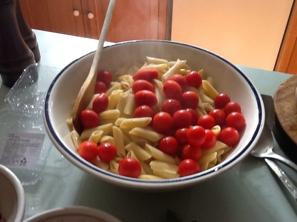 Add the tomatoes to the pasta