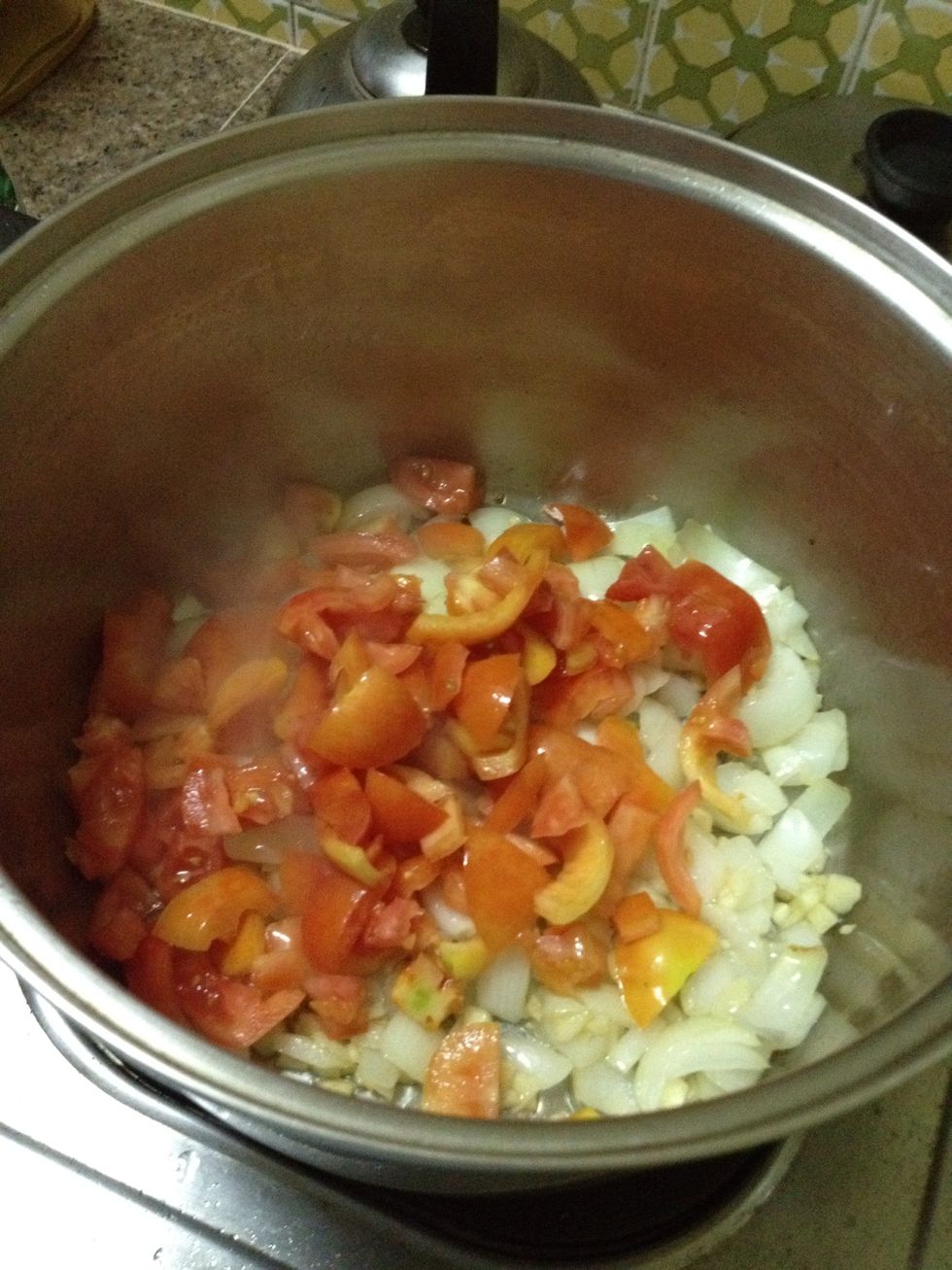 Add the tomatoes when the garlic breaks into an aroma but don't wait till the minced garlic are toasted