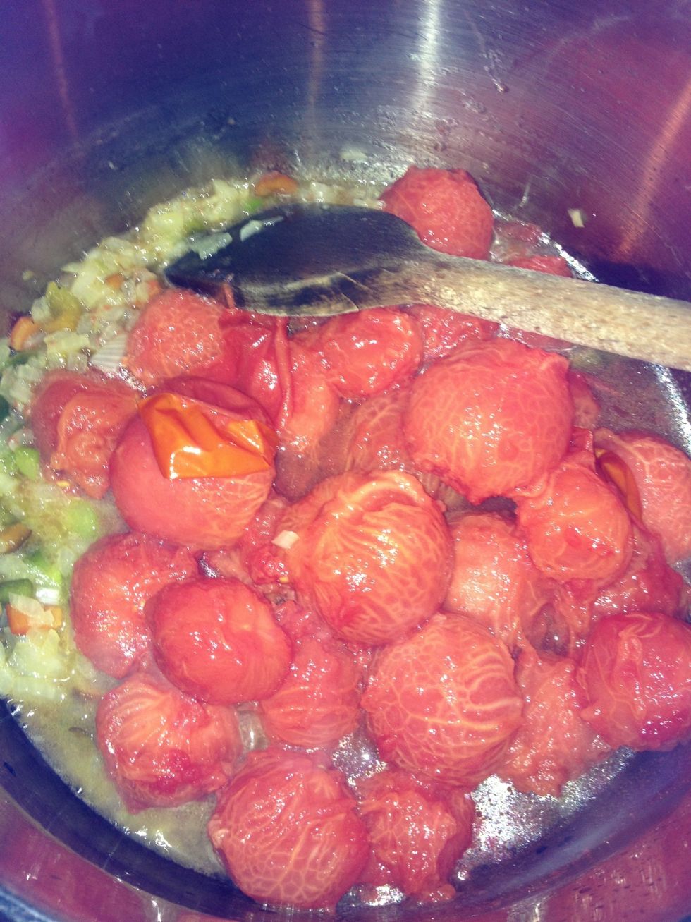 Add the tomatoes (you can see I missed a skin).