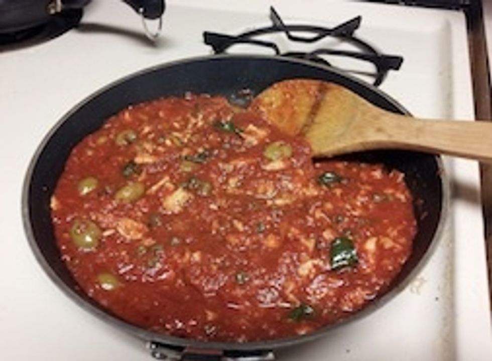 Add the tuna, breaking it up with a fork, and season with salt.