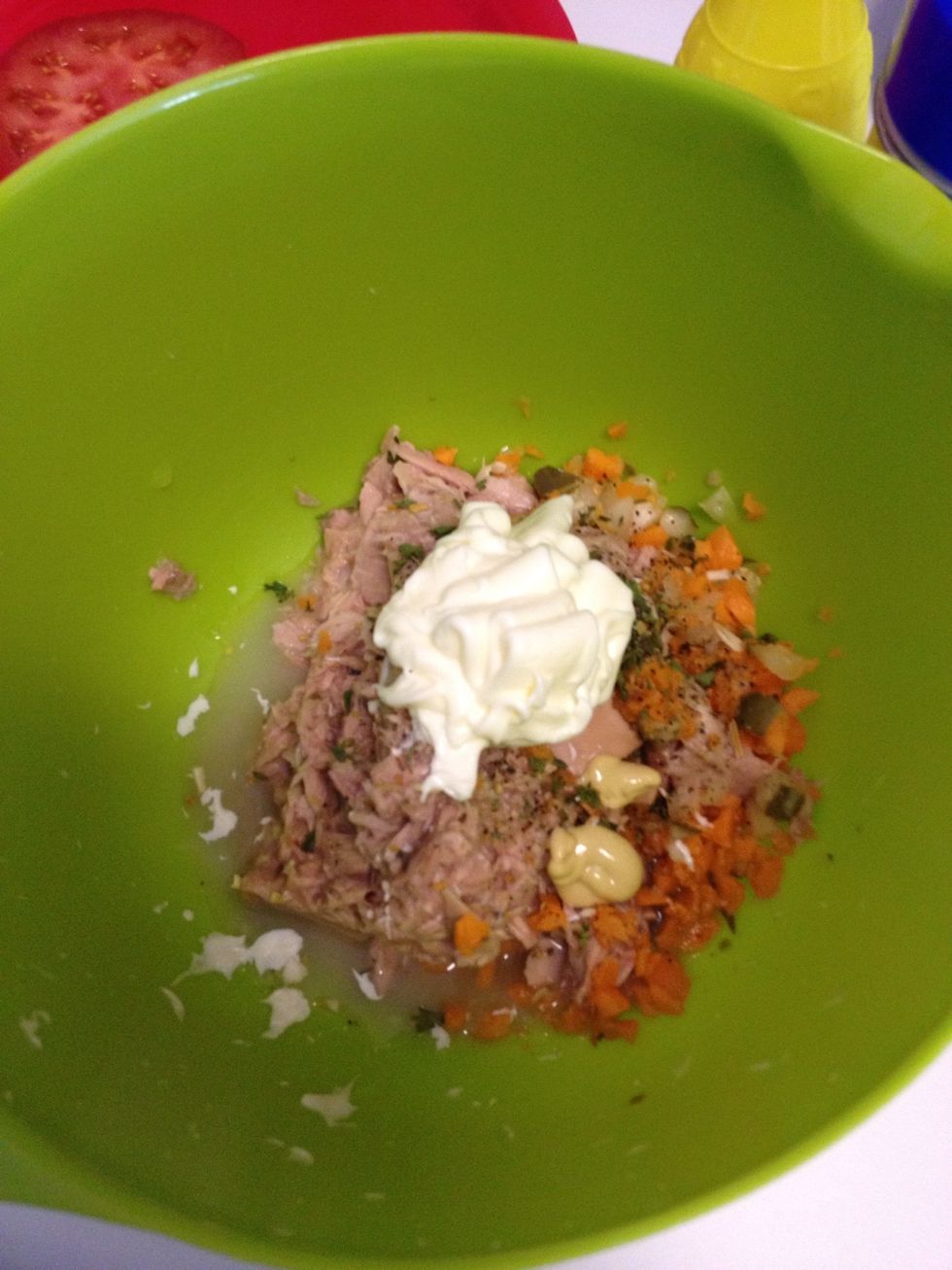 Add the tuna, mayo, carrot, pickle, mustard, lemon juice, vinegar, parsley, and salt together in a bowl.