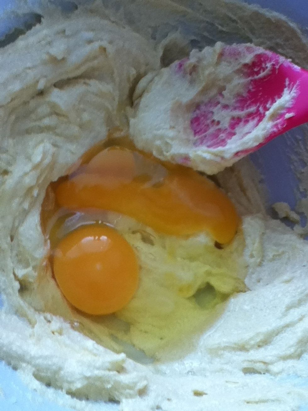 Add the two eggs into the bowl and beat again.