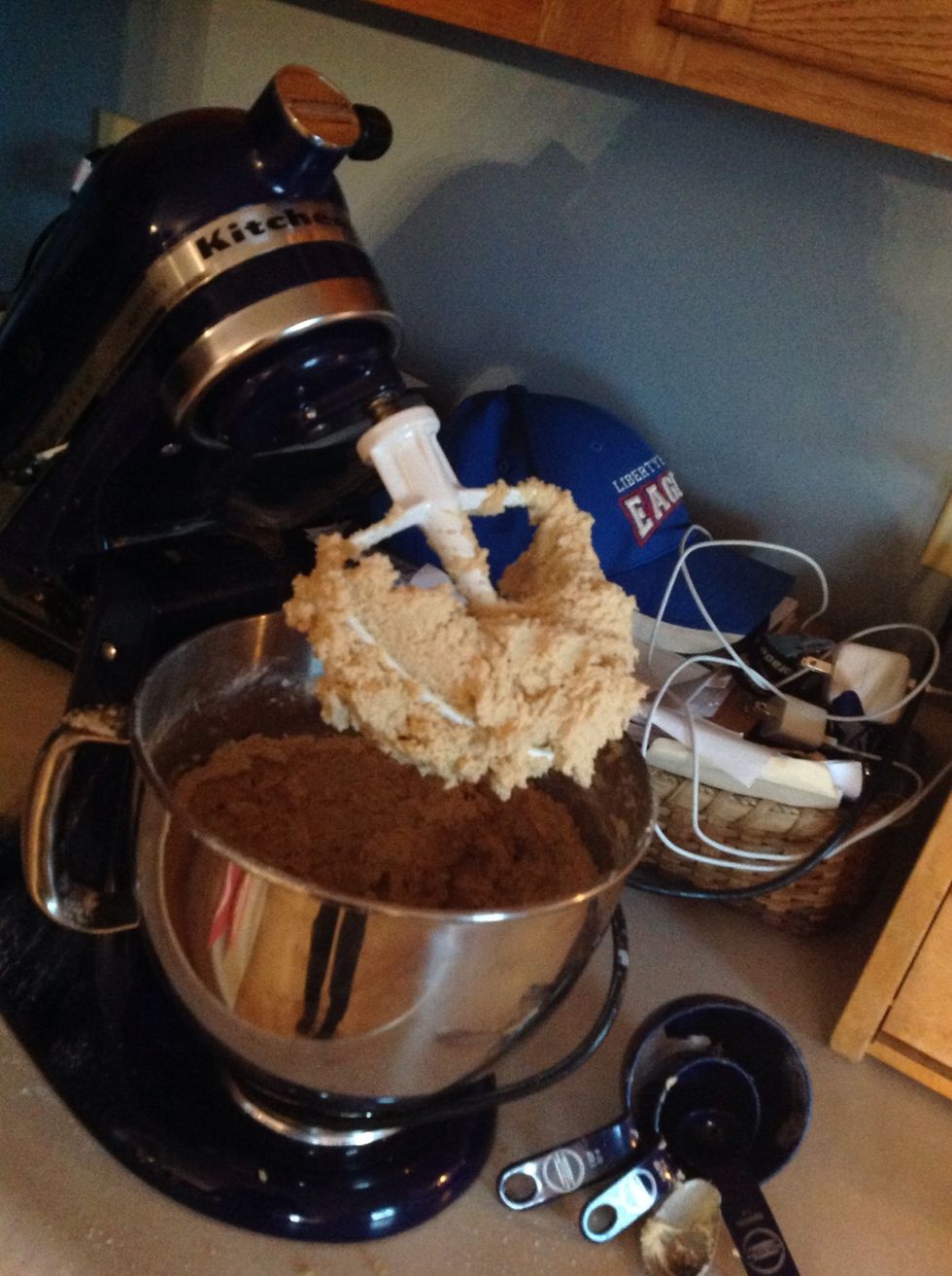 Add the two eggs one at a time, and pour in the flour mixture you made in the small bowl before.