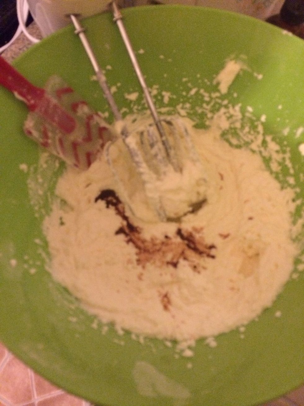 Add the vanilla and almond extract. And mix again til everything is incorporated. About a minute.
