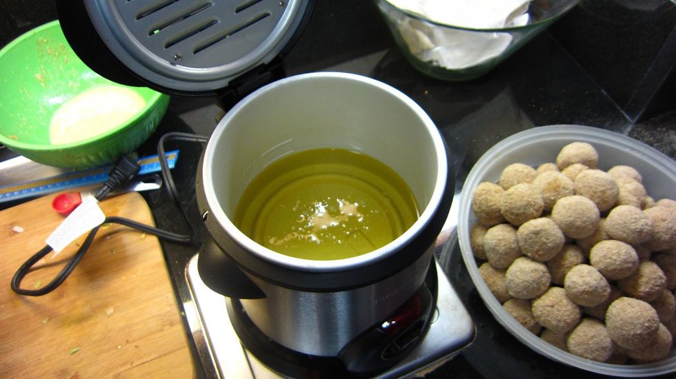 Add the vegetable oil and preheat to 390 degree F. Do not use Olive Oil which does not heat or fry well. We got this lovely mini fryer at Target in the US for $25. This way we won't waste oil.