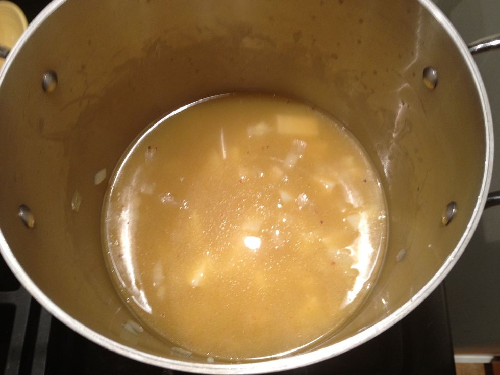 Add the vegetable stock and the water. Turn the heat up to high. While the soup is coming to a boil you can prepare your greens