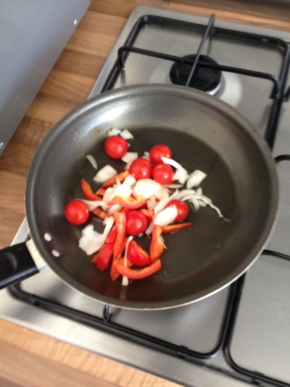 Add the vegetables to a small frying pan with a gulg of olive oil, fry on a medium or low heat for a few minutes.