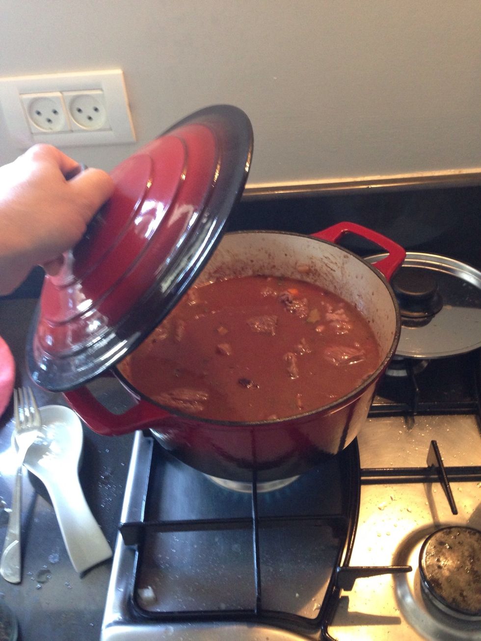 Add the vegetables, wine, beef stock, garlic, thyme, bay leaves and tomato paste and bring to boil on stove.