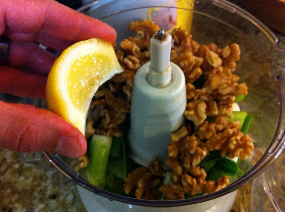 Add the walnuts and squeeze the lemon, removing lemon seeds as needed.