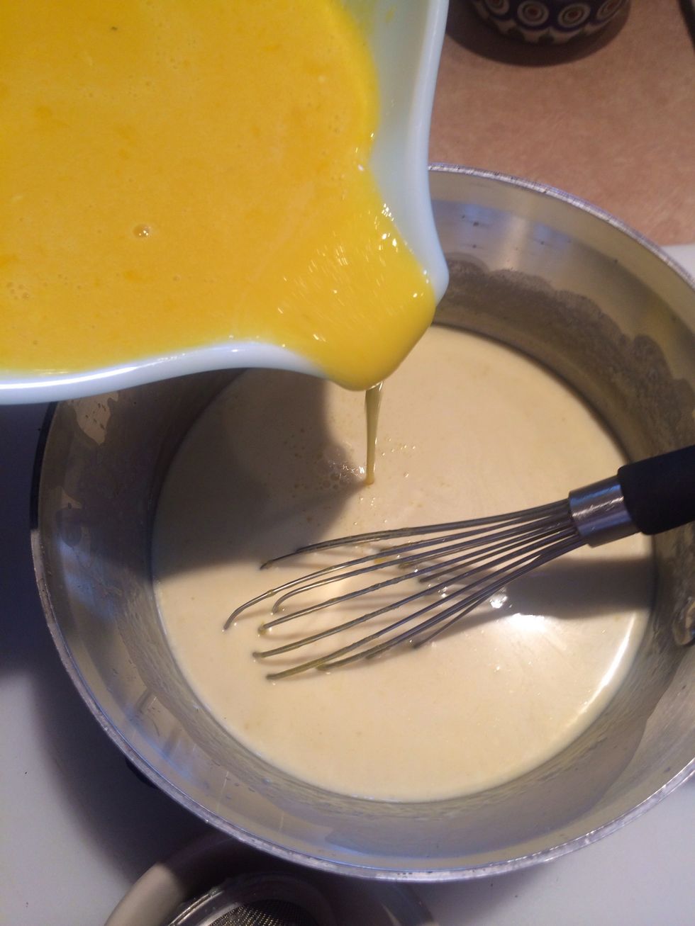 Add the warmed egg mixture to the remaining cream. Whisk together. Yes there is plenty of stirring steps here, but it's well worth it!