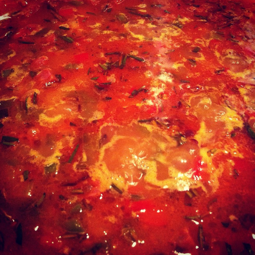 Add the water (a light vegetable or chicken stock can be used for added flavour, but in which case don't add the salt in the previous step). The water should cover the rice by just over a centimetre.