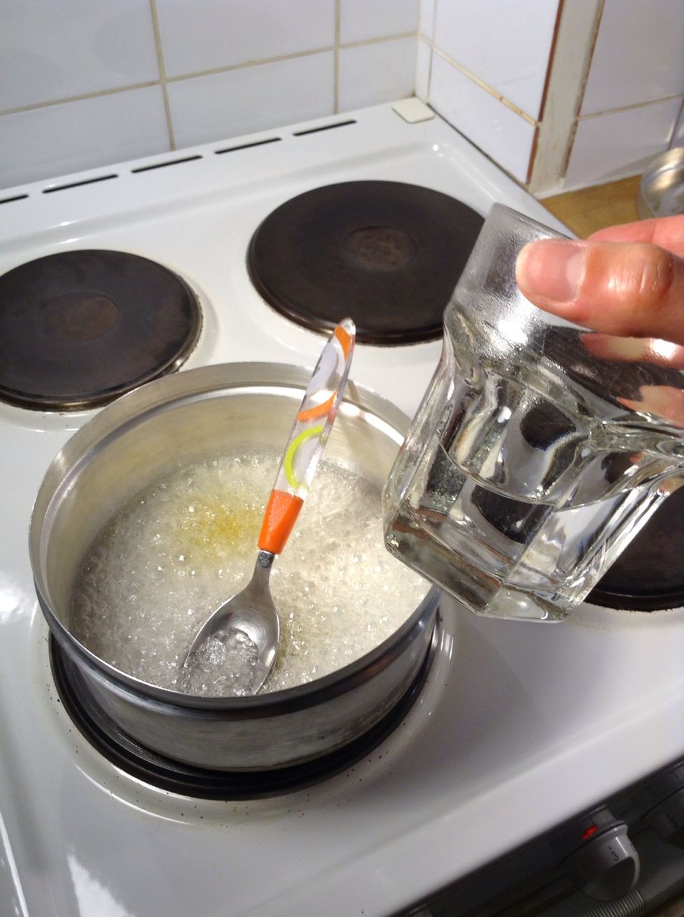 Add the water and stir with a spoon
