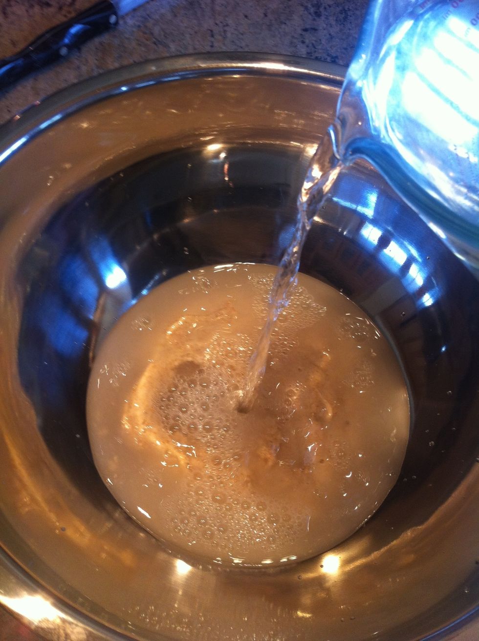 Add the water to the leaven in the bowl.