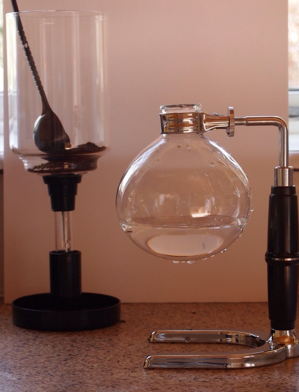 Add the water to the lower vessel and the ground coffee to the upper. Amount of coffee will depend on your own taste but as a starter try two level spoonfuls.