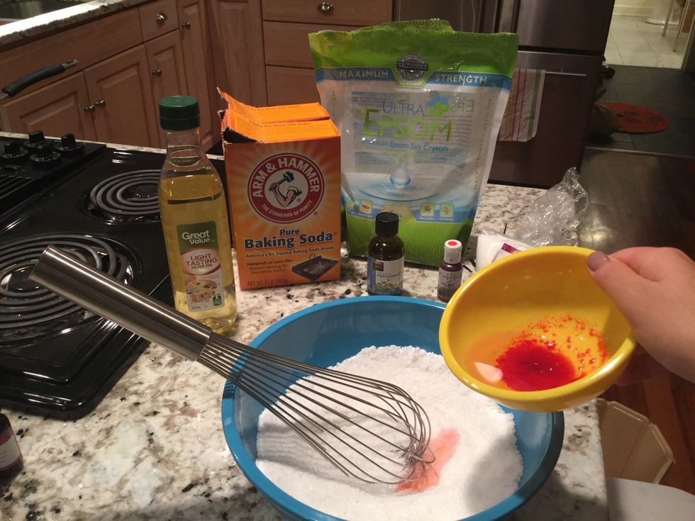 Add the wet mixture in with the dry mixture, whisking and adding a little as you go. Once the entire wet mixture is added, make sure it has all been whisked thoroughly.