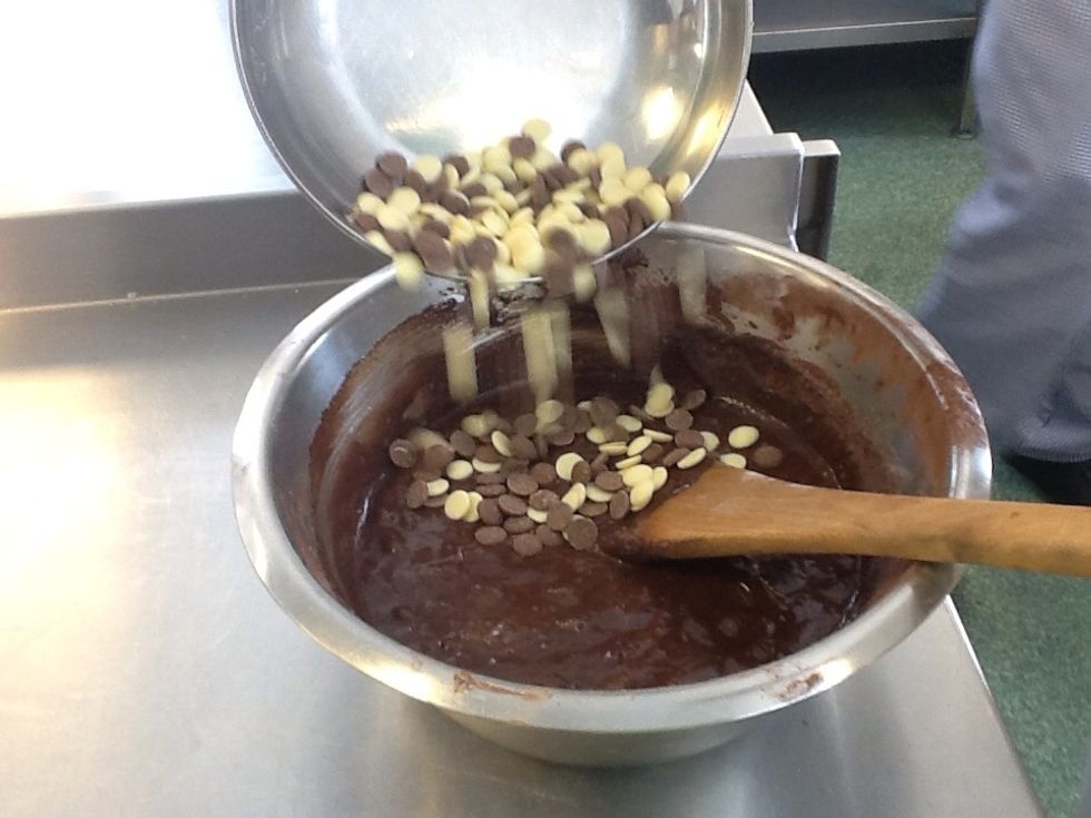 Add the white and milk chocolate into the mix and fold in a figure of 8.