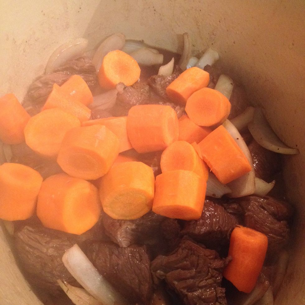 Add the wine and carrots. Let it simmer for 3 minutes.