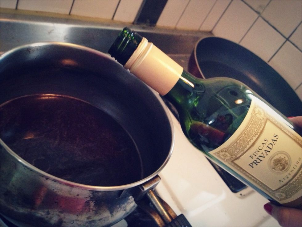 Add the wine, both sugars,lemon juice,and cinnamon sticks. Bring to A boil.