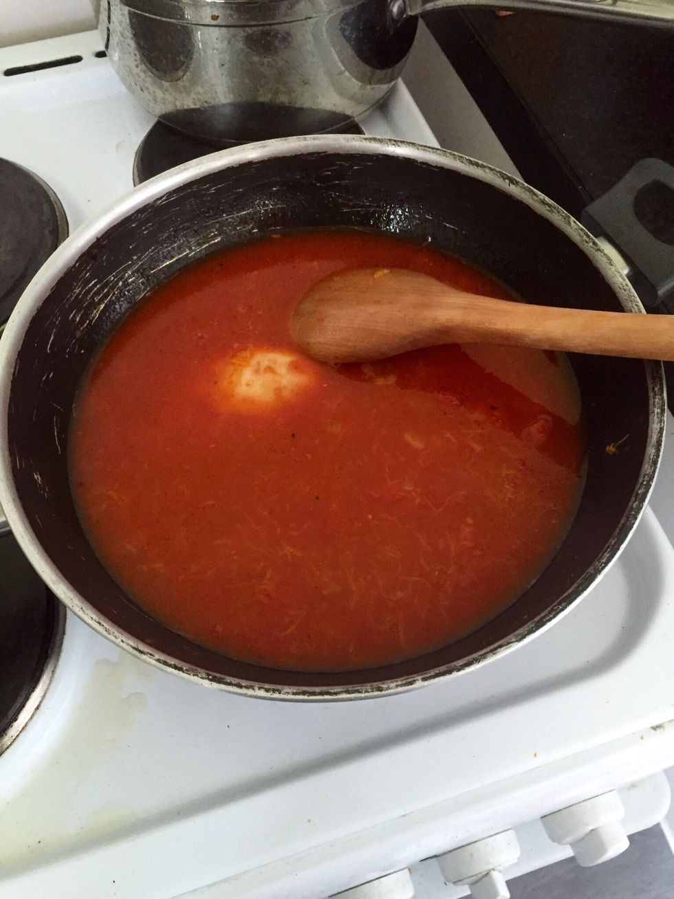 Add the wine, chopped tomatoes, juice and stock to it. I just use a cup of stock. And start reducing. For me it took around 40 minutes