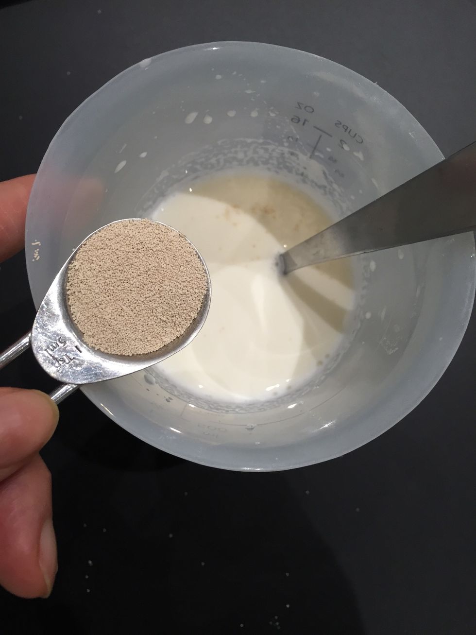 Add the yeast. And let stand for 10 mins or so.. The time u prepare the other ingredients