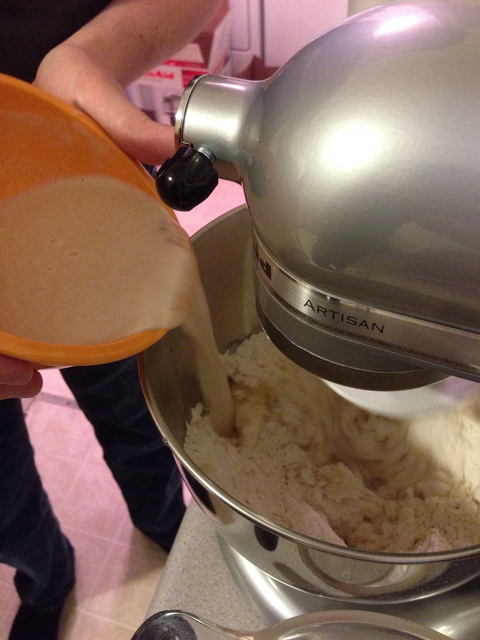 Add the yeast mixture to the flour and oil.