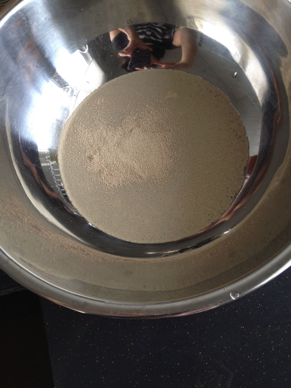 Add the yeast to the warm water and mix well.