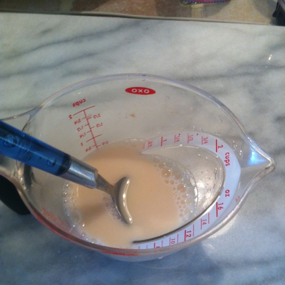 Add the yeast to the water and stir it up. Try to get rid of the clumps.