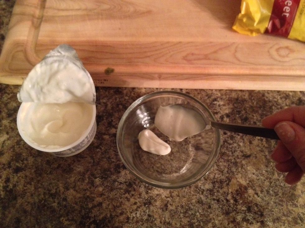 Add the yogurt into a container of your choice. Note, you can use plain yogurt instead of vanilla as long as you add a teaspoon of pure vanilla extract to it.
