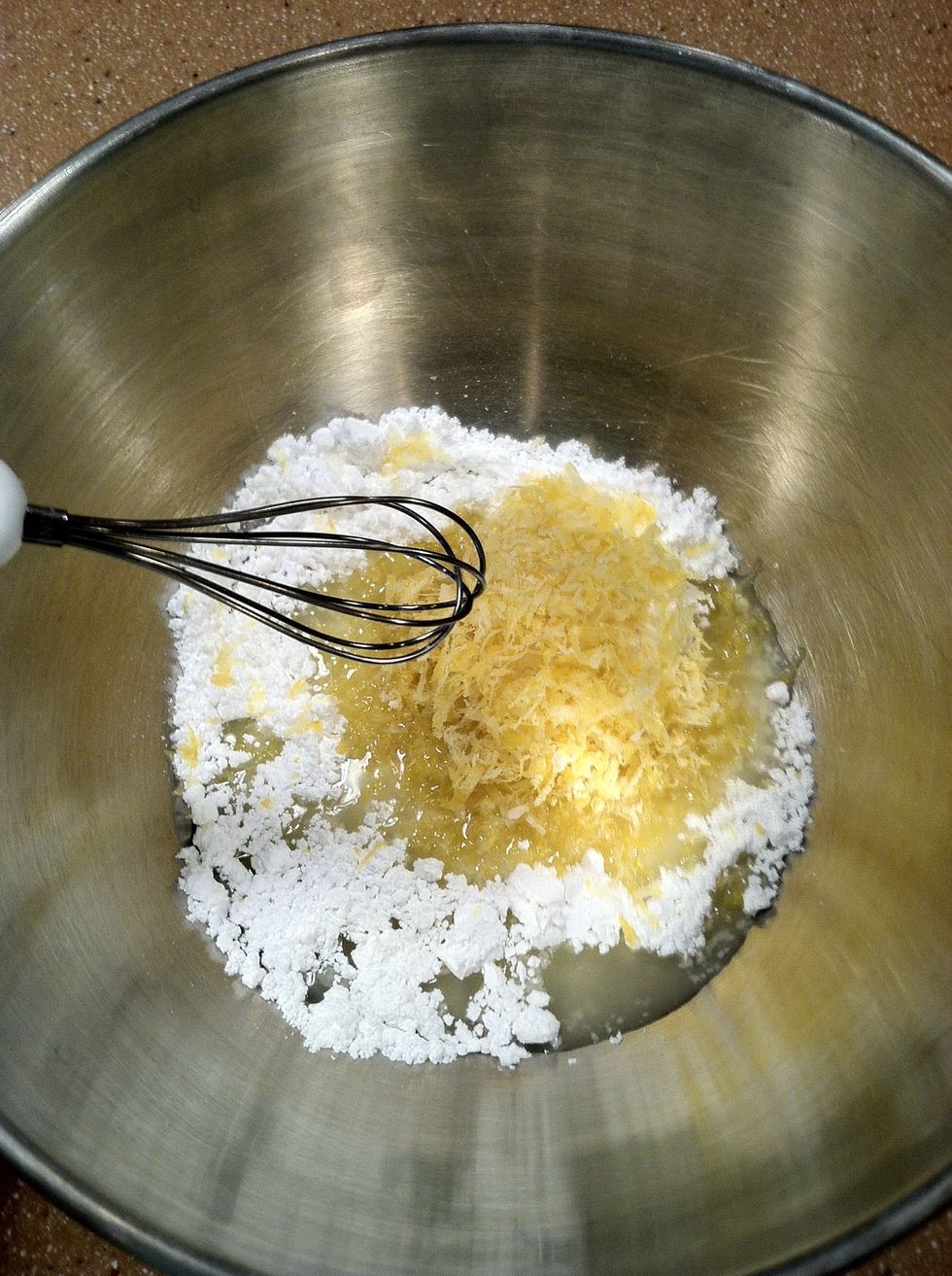 Add the zest and juice to the powdered sugar and whisk together.