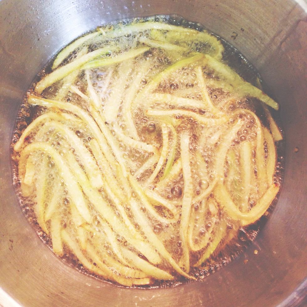 Add the zucchini to pot of hot oil and fry until brown and crispy. Transfer to a paper towel lined plate and sprinkle with salt and thyme mixture.