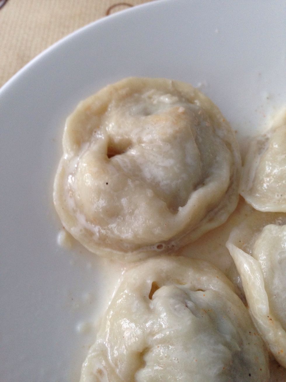 Add them in a boiling water. Don't forget to add salt again. After pelmeni fish out, boil them for 6-8 min.  Took them out of the pan and add some pepper on the top.