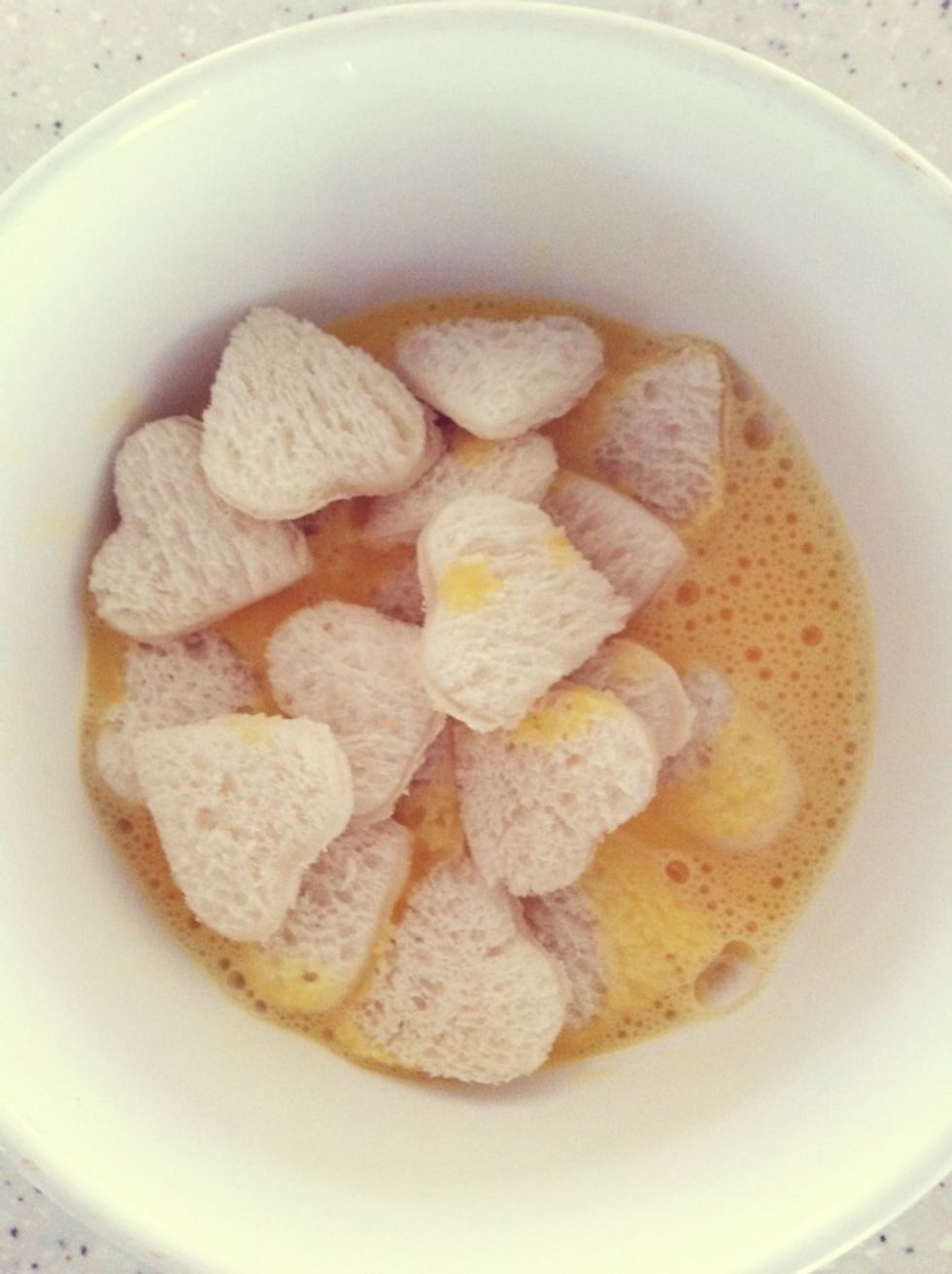 Add them into beaten egg & milk mixture.