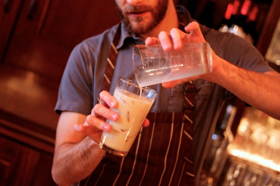 Add them to a glass with ice. Roll back and forth between two glasses to mix.