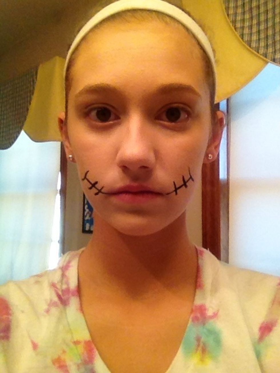 Add this design for the mouth with the liquid eyeliner.