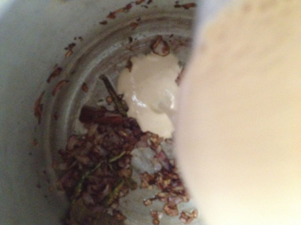 Add this paste to the pan and stir it. Once it starts oozing oil and starts turning brown. Add all the dry spices and cook for 2-3 mins.