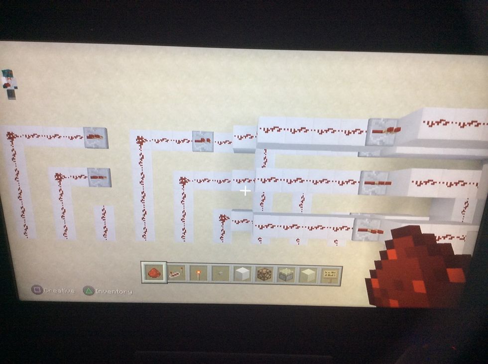 Add this redstone and repeaters.  Note:move the repeater that is on the ground back one block.