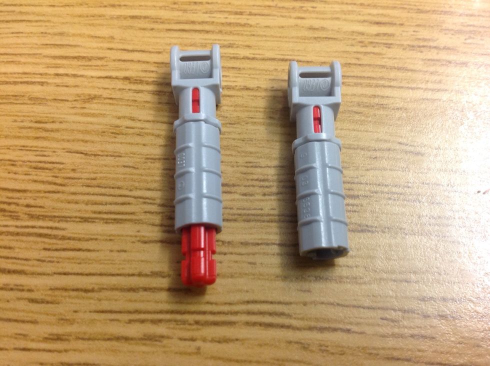 Add those cylinder pieces and put another rod in one of them.