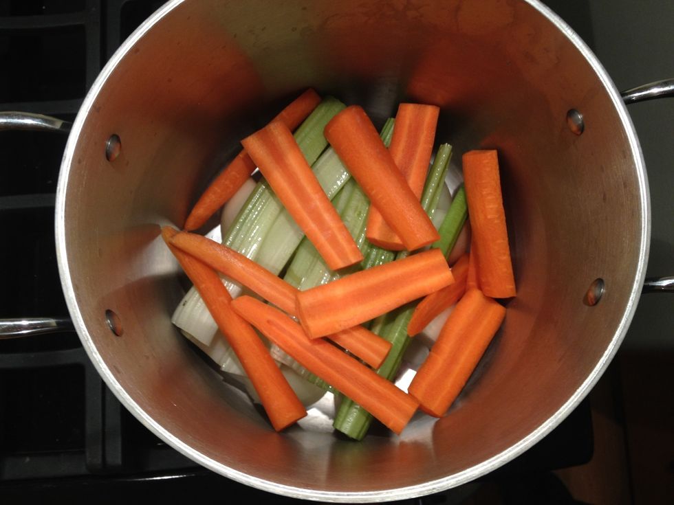 Add three carrots halved lengthwise.