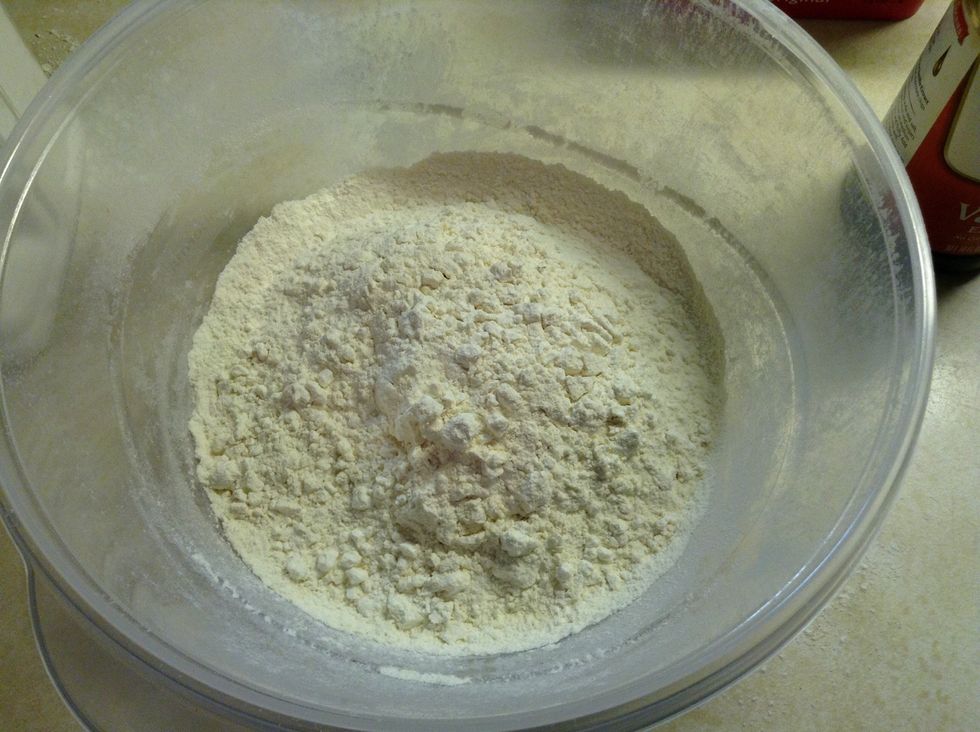 Add three cups of flour, then add 1-1/2 teas of baking powder to the flour, than add 1/2 teas of salt to the flour. Than add 1 cup of sugar.