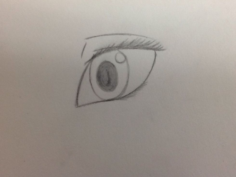 Add three lines above the eye as seen in the picture. This will show that the character had eyelids. (Can you imagine how creepy it'd be to not have eyelids?)