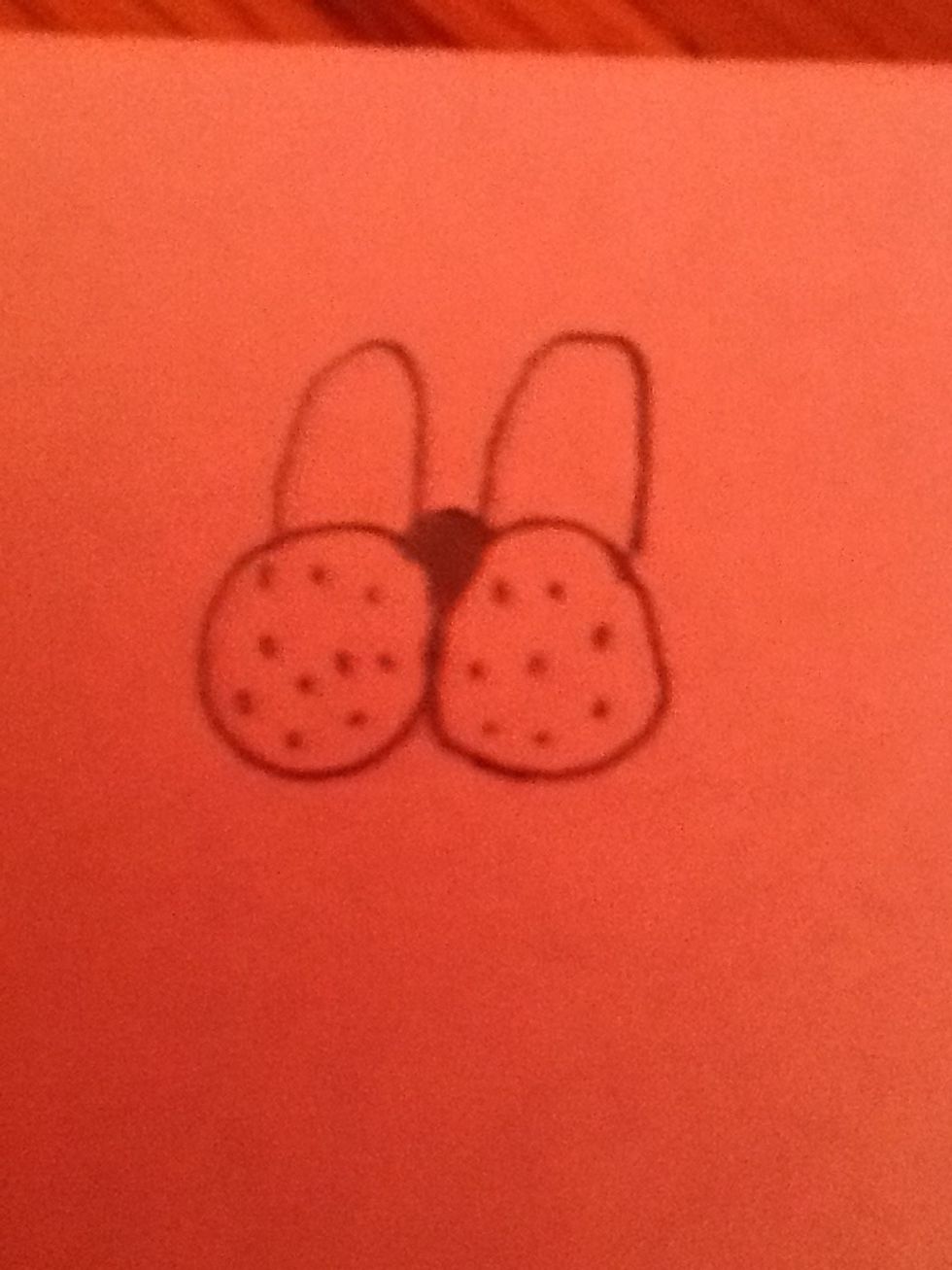 Add three lumps as a nose and two eyes. Color the nose lump in