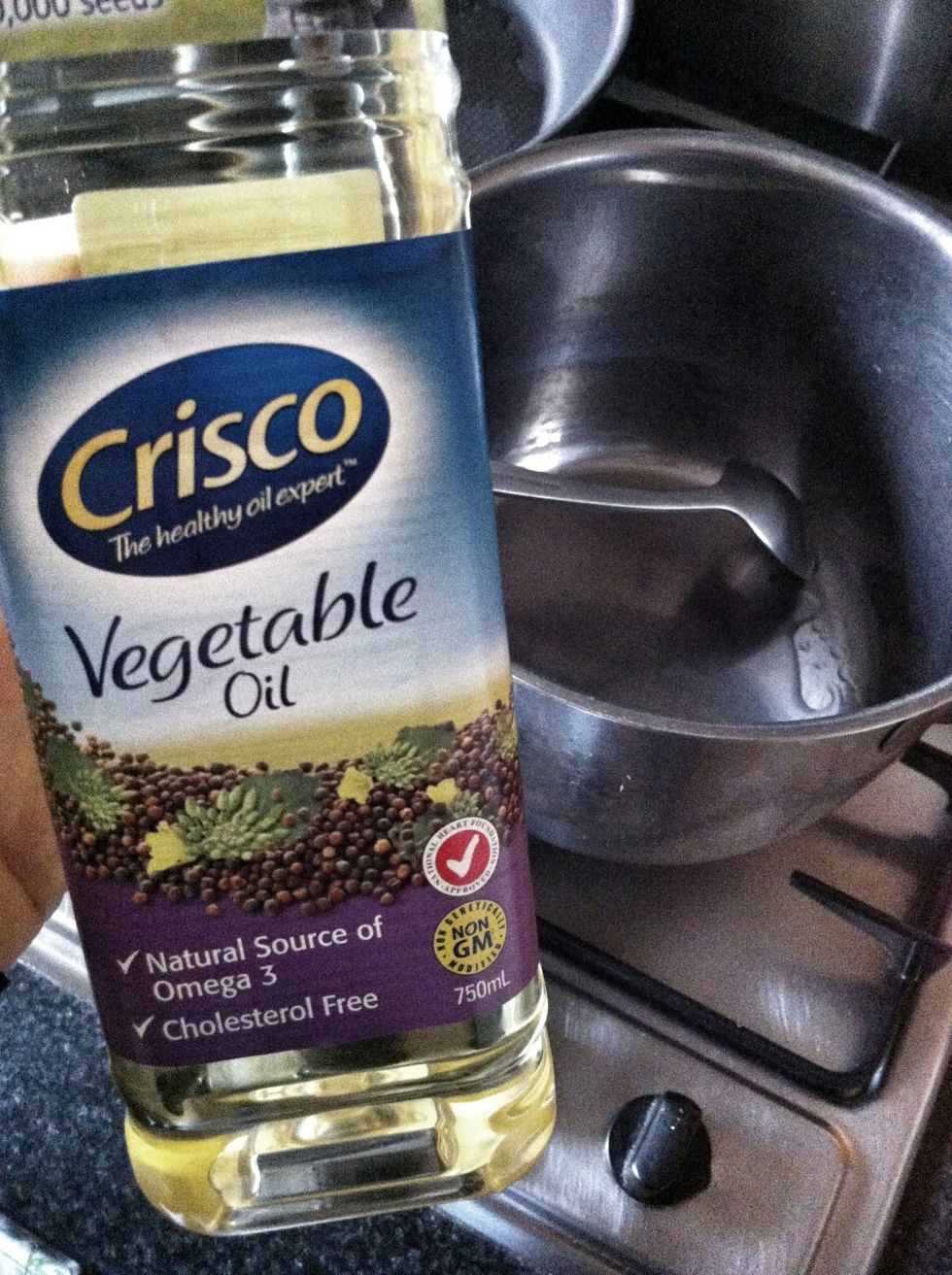 Add three tablespoons of oil to the pot, and turn the heat on medium.
