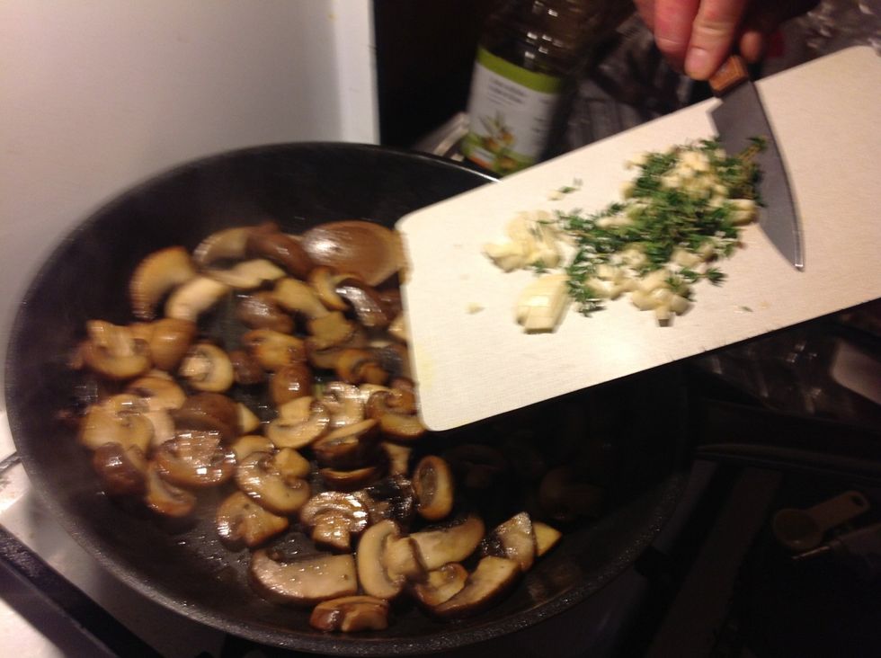 Add thyme and garlic to mushrooms
