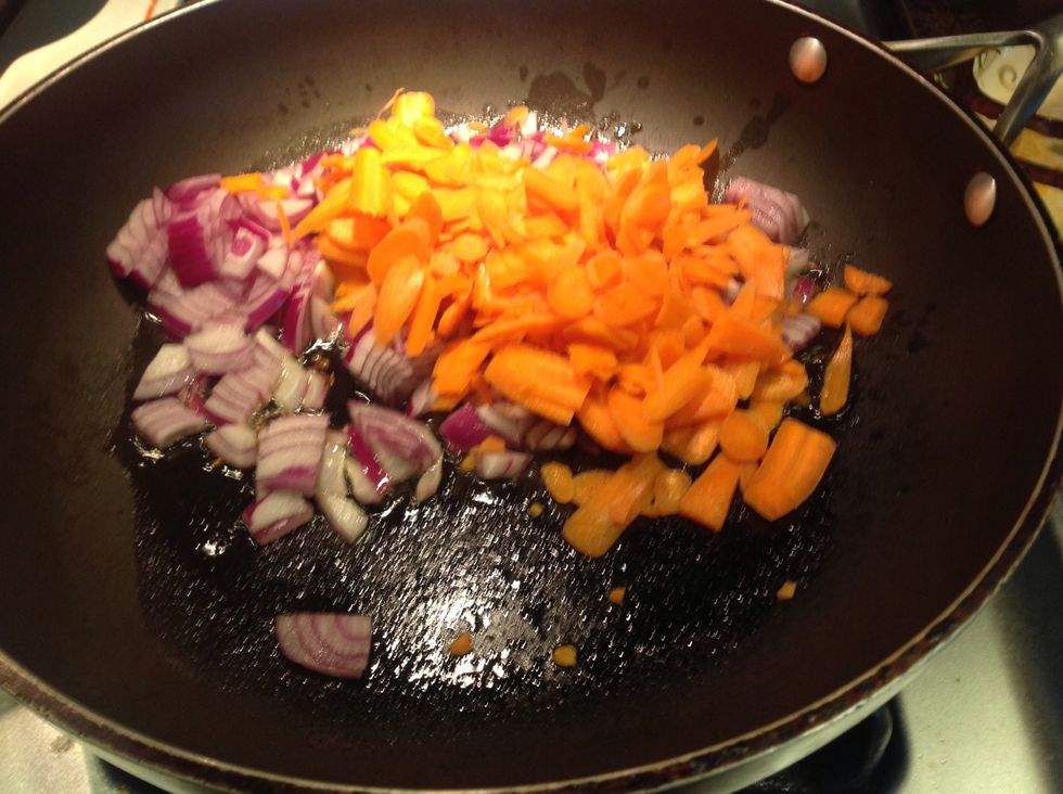 Add to the pan chopped onion and thin slices of carrots.  I put baby carrots in food processor with slicer. Cook while stirring occasionally until carrots are almost soft and onions are translucent.