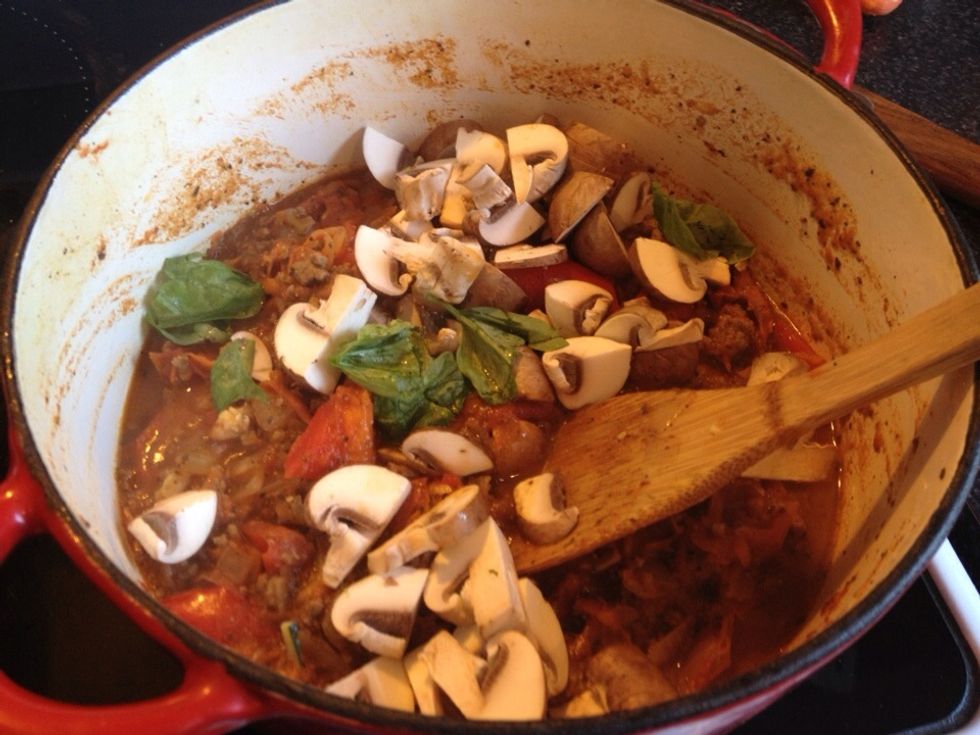 Add to the pot. If you're using fresh herbs, now is the time to throw them in. I'm adding fresh basil; parsley might be nice too.