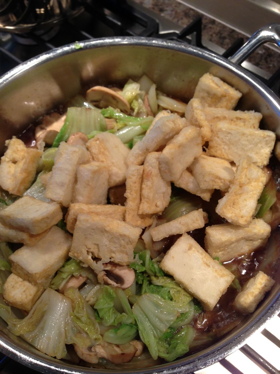 Add tofu, drizzle soy sauce.