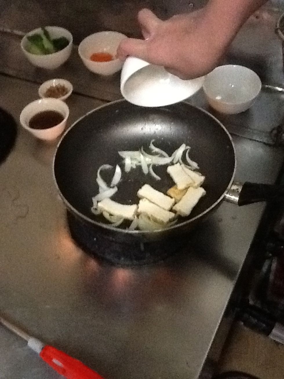 Add tofu into the pan