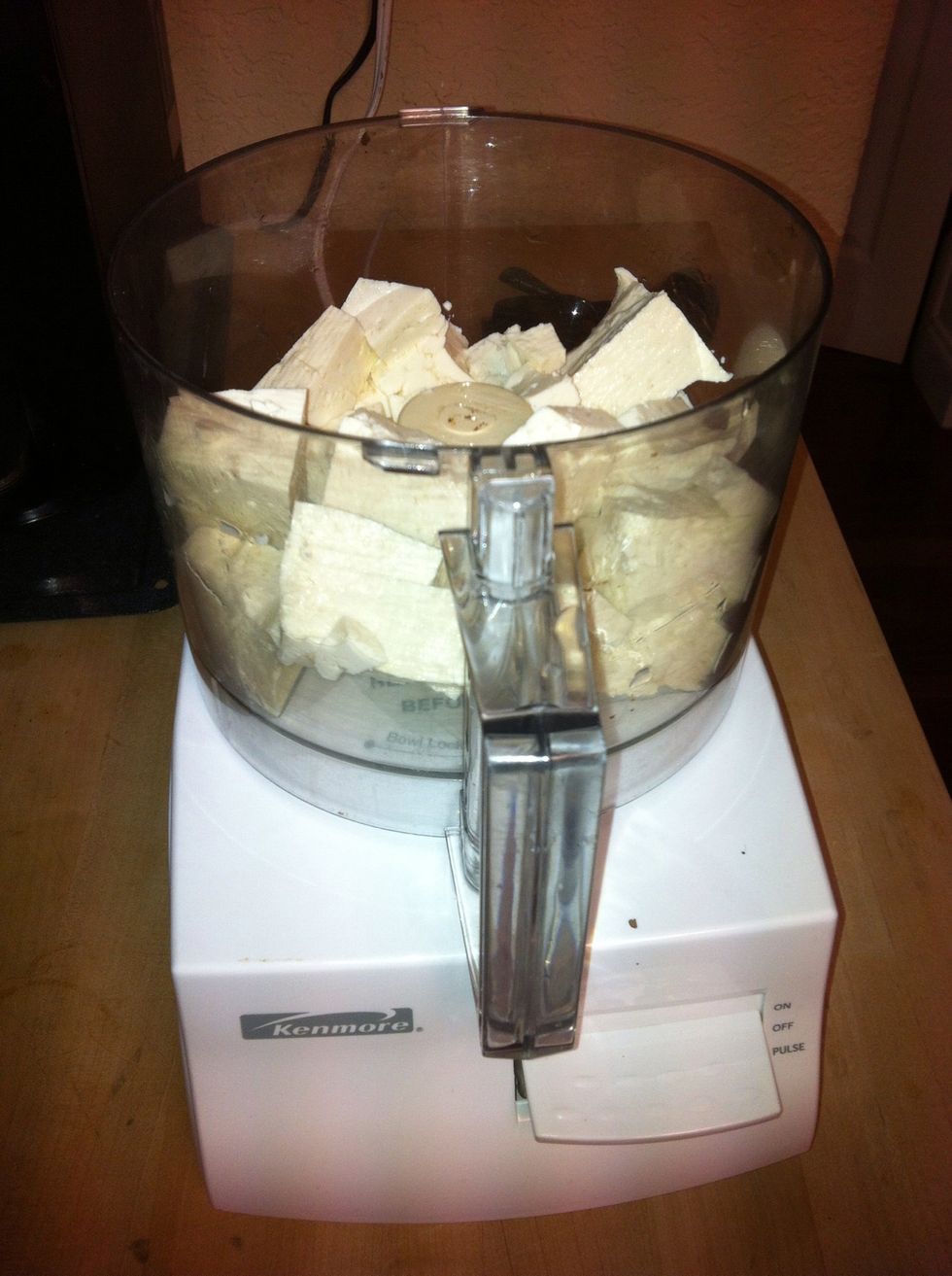 Add tofu to food processor.