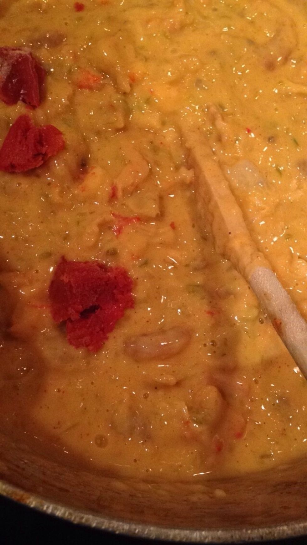 Add tomato paste and mix in